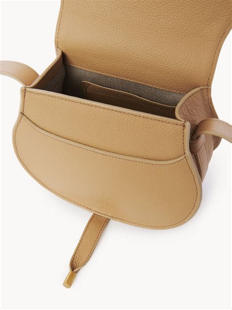 Small Marcie saddle bag in grained leather .